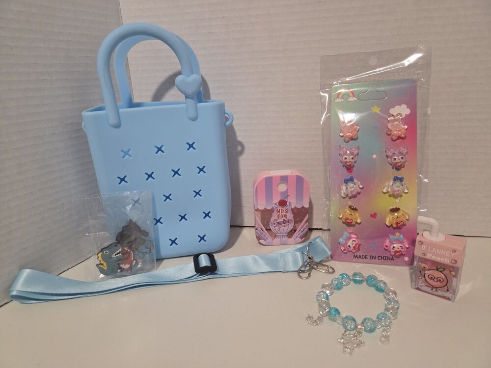 5 piece girls set includes  Small Silicone charm bag w/ crossbody strap & Charm